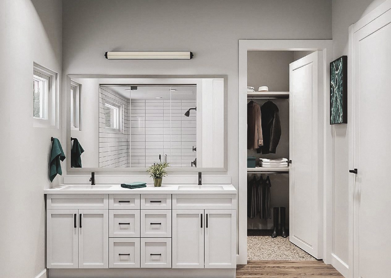 a bathroom with a white vanity and a large mirror at The parcHAUS at Mustang Drive
