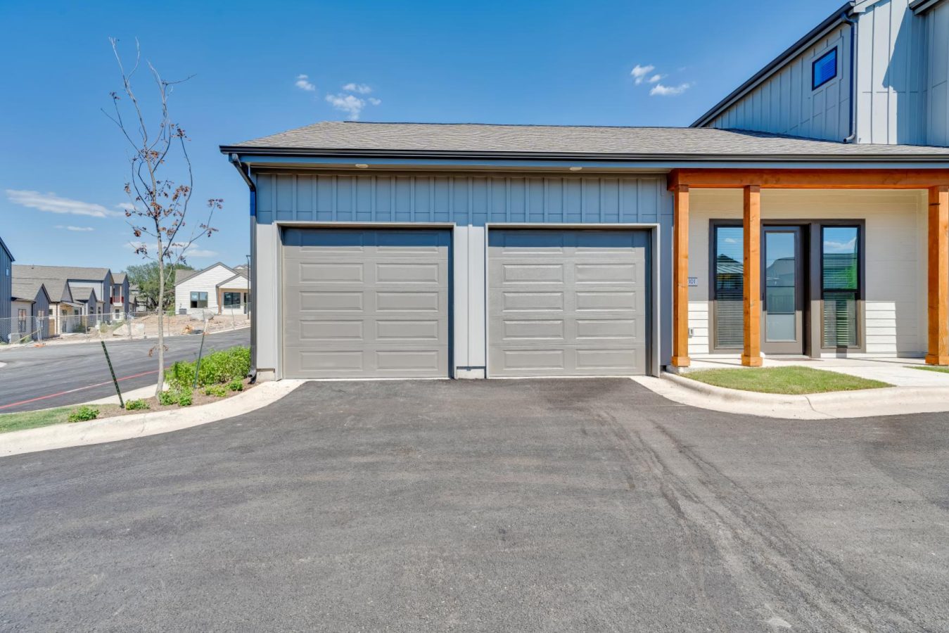 Exterior view of two garages for units at parcHAUS at Mustang Drive